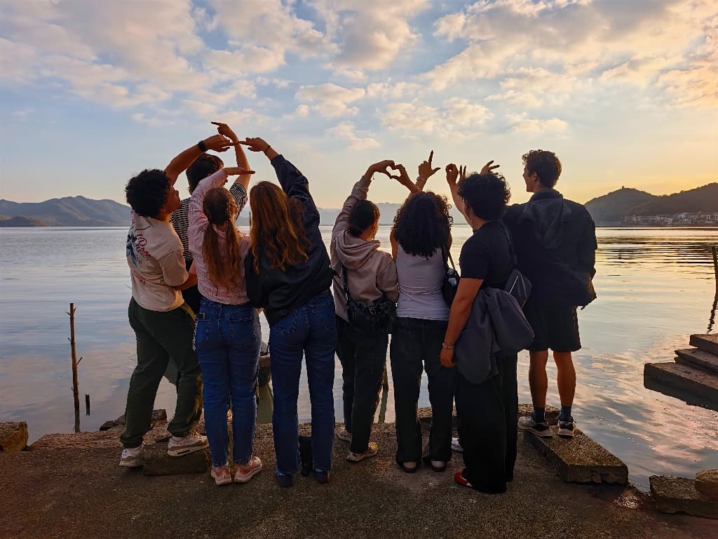 Students forming AFEC by a lake